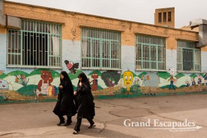 Women in Chador going along a kindergarden in Yazd, Kashan, Iran