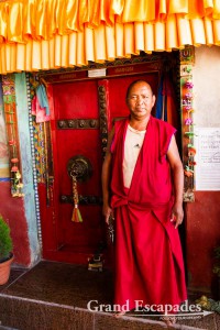 Monk in front of the door, Diskit Monastery or Diskit Gompa, Shyok Valley, Baltistan, Ladakh, Jammu & Kashmnir, India