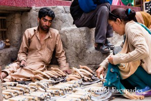 Man selling pruning knifes in the market of Leh, Ladakh, India