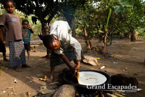 Preparing an Injera - Ari Village, near Jinka, Lower Omo Valley, South Ethiopia