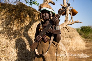 The most distinctive of all ethnic groups in the Omo Valley: the Mursi, famous for the huge Lip Plates the women are sporting. Mago National Park, near Jinka, Lower Omo Valley, South Ethiopia