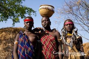 The most distinctive of all ethnic groups in the Omo Valley: the Mursi, famous for the huge Lip Plates the women are sporting. Mago National Park, near Jinka, Lower Omo Valley, South Ethiopia
