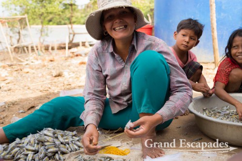 Woman preparing the baits for the crab fishing, islands near Kep, southern Cambodia