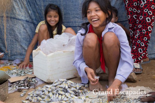 Woman preparing the baits for the crab fishing, islands near Kep, southern Cambodia
