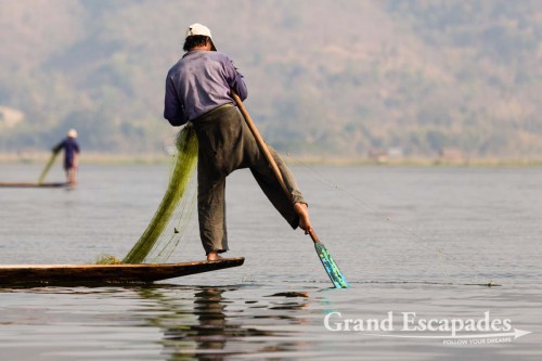 Fishermen on Inle Lake, Myanmar - Them rowing their boats with one leg contributed to making the lake a legend. This technique allows them to throw / pull their nets with both hands.