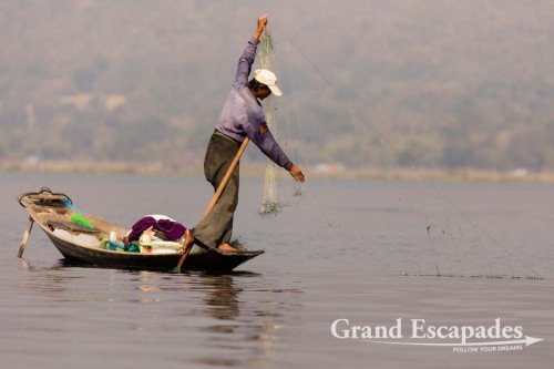 Fishermen on Inle Lake, Myanmar - Them rowing their boats with one leg contributed to making the lake a legend. This technique allows them to throw / pull their nets with both hands.