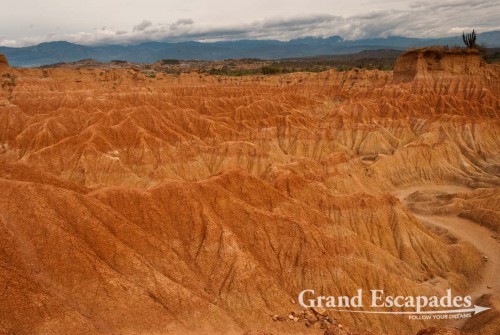 A short walk from the Observatory takes you into amidst incredible rock formation of different reddish colours, the ?Laberintos de Cusco? (Cusco Labyrinths), dotted with different cactuses. The little towers, cliff and ravines were sculptured by the wind and infrequent rain