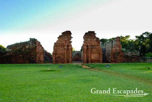 The ruins are slowly being restored with the most impressive remnant being the enormous red sandstone church, or what is left of it. The portal of the church is especially intriguing with its exquisite carving. The side walls of the church are supported by wooden beams - Misiones San Ignacio, Misiones, Argentina