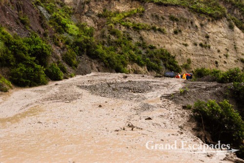 Next thing we saw was a car stuck in a huge mudslide and a few people trying to help. We did not realize how bad it was until we tried to reach the car to see if we could help. The road was blocked by a huge mash of rocks and mud moving like lava. We found ourselves up to our knees in this mess. At the same time more mud was coming down the mountain and we quickly retreated to what we thought was safe terrain.
