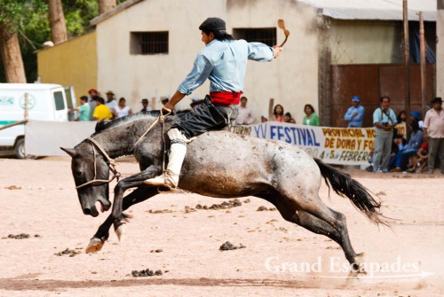 Crina Limpia - It is a gaucho trying to stay on a horse without a saddle, only holding on to a rope tied around the horse?s neck pushing his long spurs into the horse?s belly. The gaucho has to stay on the bucking horse for 13 seconds, otherwise he is disqualified - Maimara, near San Salvador de Jujuy, Northwest Argentina