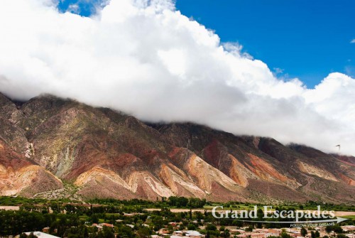La Quebrada de Humahuaca - A magic display of colours, dark red or pinkish hills and whitish cliffs with brown tops are often twisted into bizarre formations