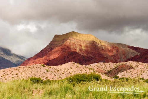 La Quebrada de Humahuaca - A magic display of colours, dark red or pinkish hills and whitish cliffs with brown tops are often twisted into bizarre formations
