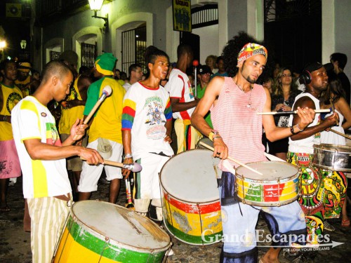 The Samba school moves around the city center and demonstrate Samba music & dance with ambitious female tourists too happy to show what they learned during their Samba Class! Salavdor de Bahia, Brazil