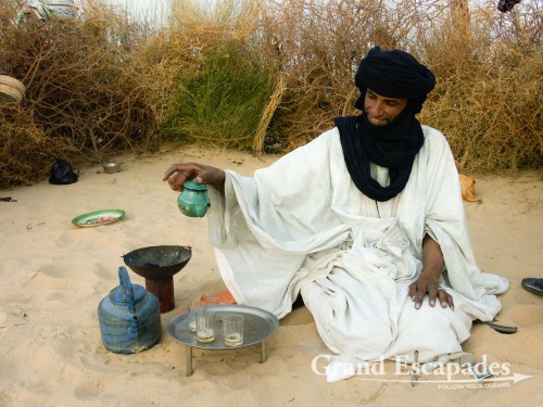 Serving Tuareg tea in the Sahara, Timbuktu, Mali