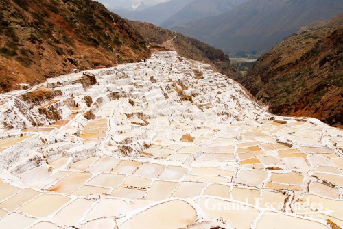 The salt pans near Maras are are fed by a little salty river that emerges from the mountain, near Cuzco, the Sacred Valley, Peru