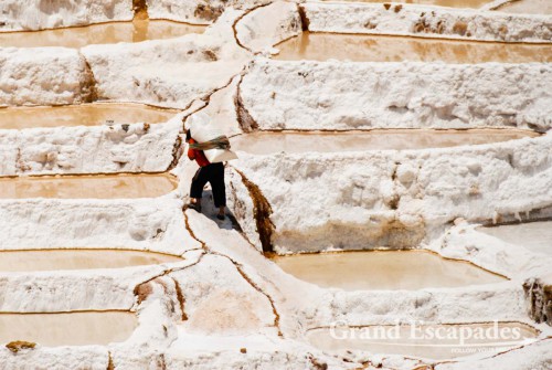 The salt pans near Maras are are fed by a little salty river that emerges from the mountain, near Cuzco, the Sacred Valley, Peru
