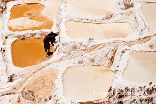 The salt pans near Maras are are fed by a little salty river that emerges from the mountain, near Cuzco, the Sacred Valley, Peru