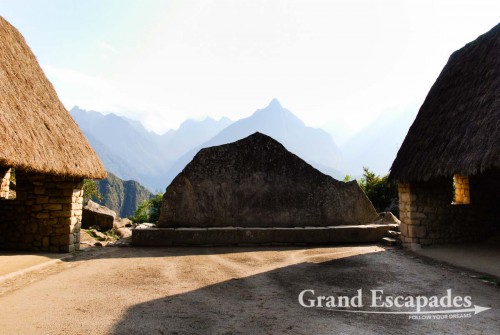 Large stone mirroring the mountain behind - it was used by the Incas for astronomic observations, Machu PIcchu, Peru