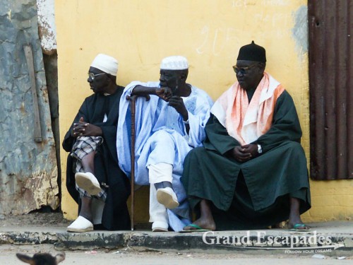 The "Anciens" sitting in the shade and watching life go by ...