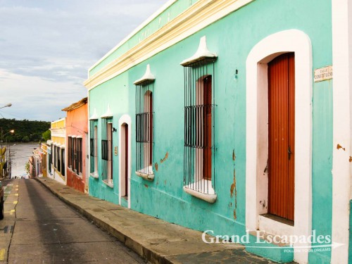 Colonial historic center, with colourful houses and tall window behind beautiful iron-works, Ciudad Bolivar, Venezuela