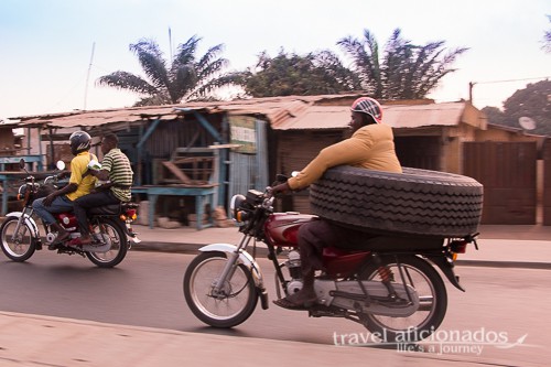 Man transporting tire